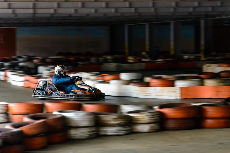 Dynamic karting competition at speed with blurry motion on an equipped racecourse