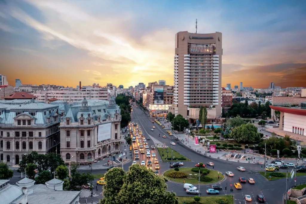 Traffic in the center of the capital city of Romania, Bucharest at dusk.